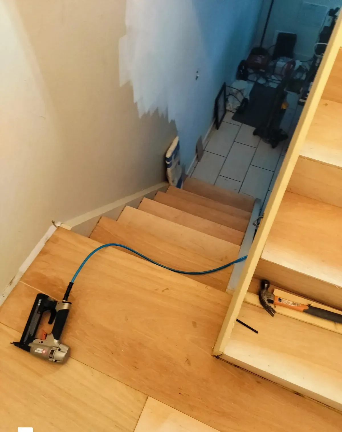 Finished staircase flooring with handrail wiring cleaned up