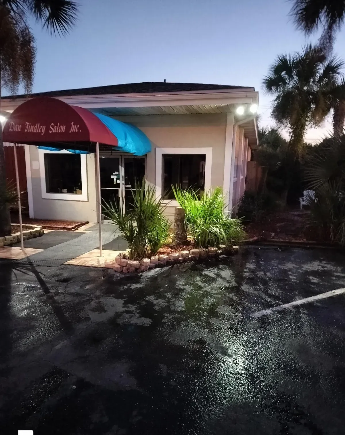 Storefront exterior repair and touch-up at night