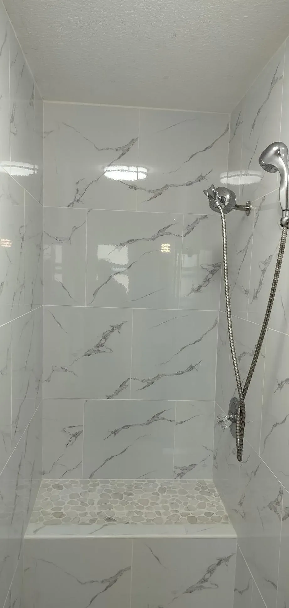 Retiled marble-look shower surround